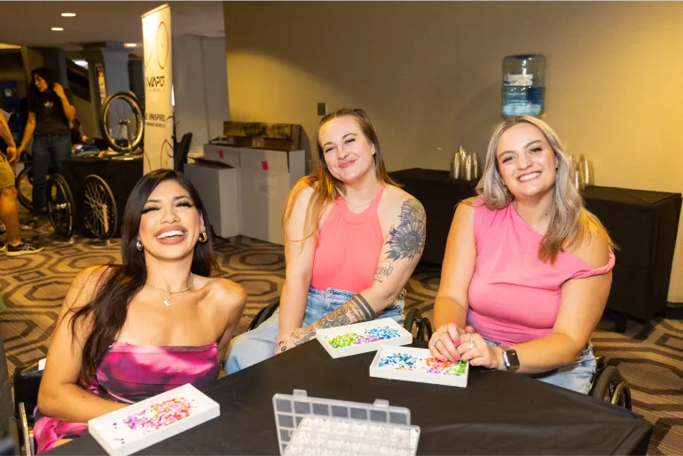 Rollettes Edna Serrano, Danika Whitsett and Conner Lundius participate in a crafting activity at the Rollettes Experience.