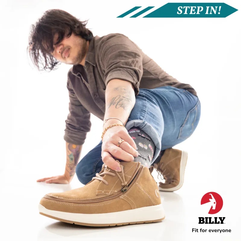 A young man is lunging with his left foot forward to show off his accessible, zip-up BILLY shoes. It reads: Step in! BILLY Fit for everyone.