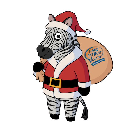 Rarity, the zebra Rare Patient Voice mascot, is dressed in a red Santa coat and hat with a sack over her shoulder. The sack reads: Rare Patient Voice Also Non-rare.