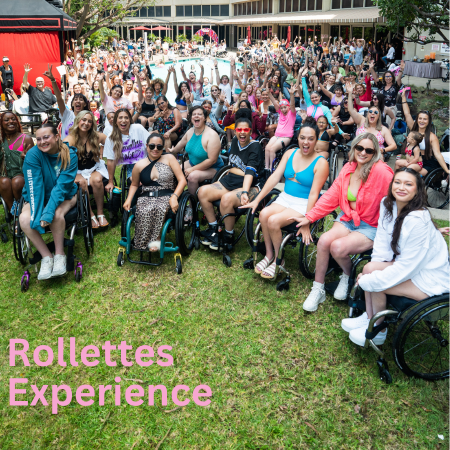 A groups of wheelchair user from the Rollettes Experience pose for the camera.