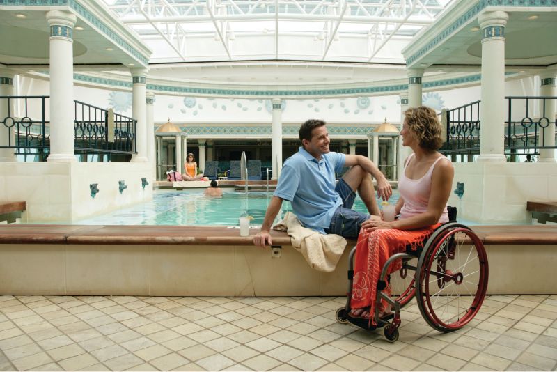 Couple on cruise ship, by pool.