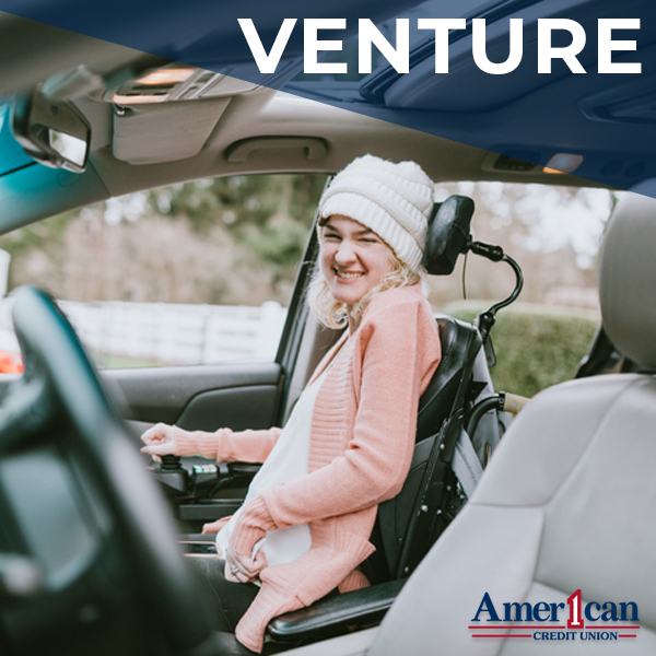 Photo of a rear-view mirror with a red car air freshener hanging down. It reads: Leave high rates in the rear view. Rates as low as 4.99% new and used auto loans. Apply today. American 1 Credit Union.