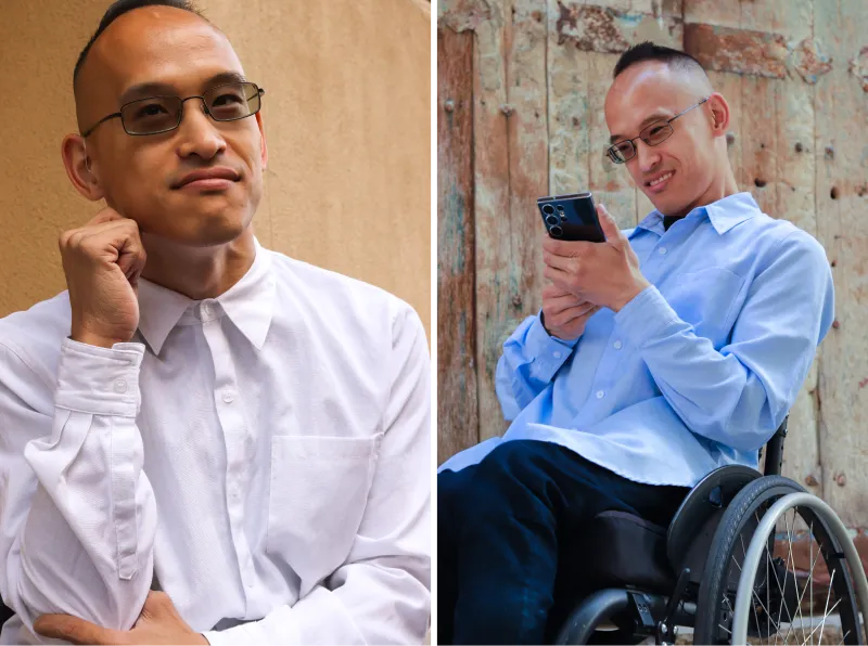 A wheelchair user is modeling a stylish adaptive button down dress shirt in white and light blue.