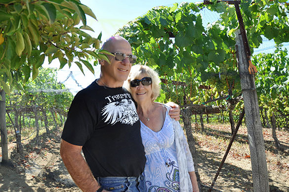 Chris Rohan with her husband at vineyard.