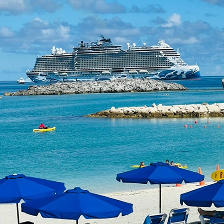 A cruise ship near a beach.