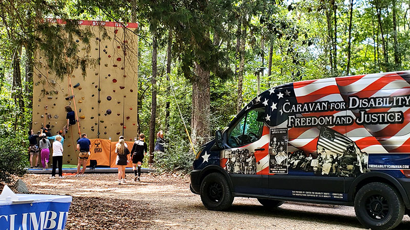 The Caravan stops for fun adaptive climbing wall experience.