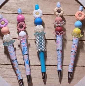 Photo of colorfully beaded and decorated pens.