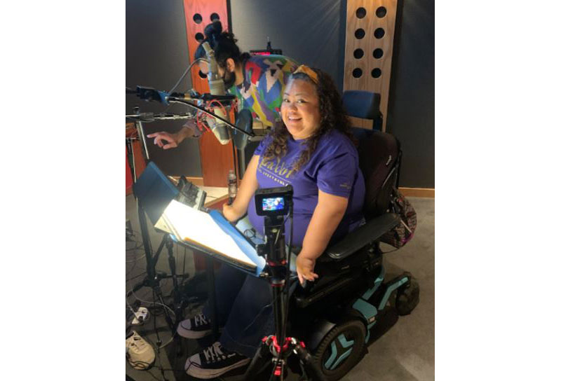 Jennifer Kumiyama is working in the recording studio, voicing her character from Disney's Wish, Dahlia.