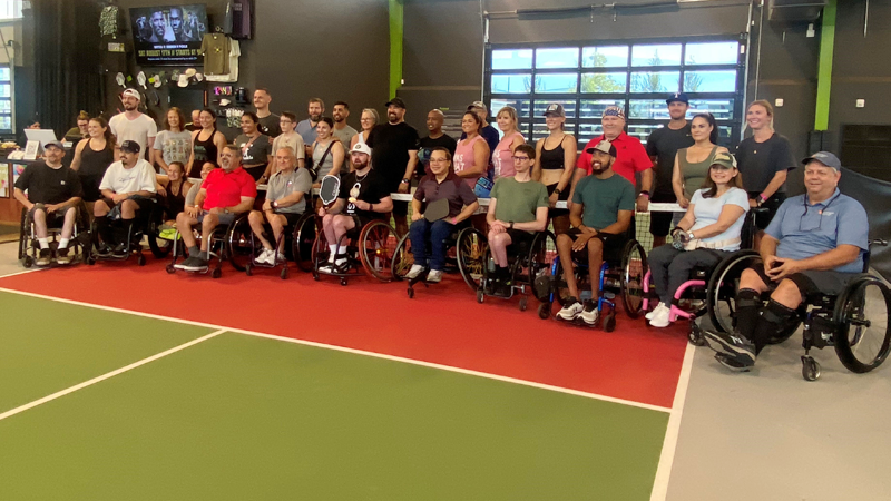 Photo of pickleball players lined up