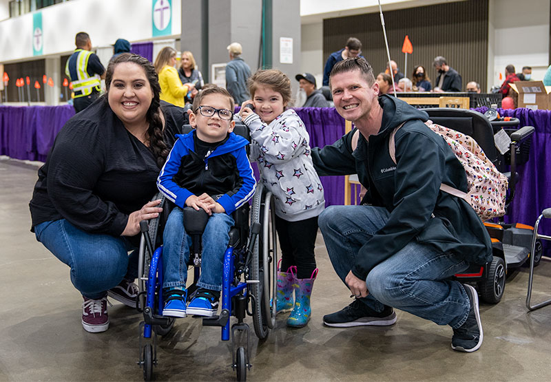 Family smiling at Abilities Expo