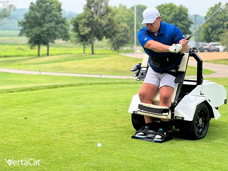 Intent on the ball and standing upright with the help of the VertaCat, a golfer is poised for an epic swing.