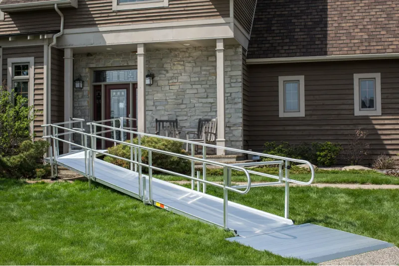 A Lifeway Mobility ramp makes the approach to the front door of a house completely accessible.